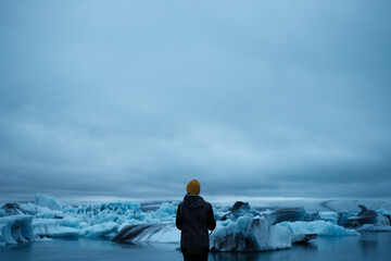 Woman traveler Hiking Around Jökulsárlón Glacier Lagoon In Iceland