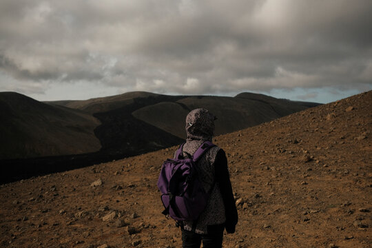 Scenery View Of Yang anonymous Women looking on volcano in Iceland