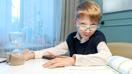 the boy solves examples on the abacus