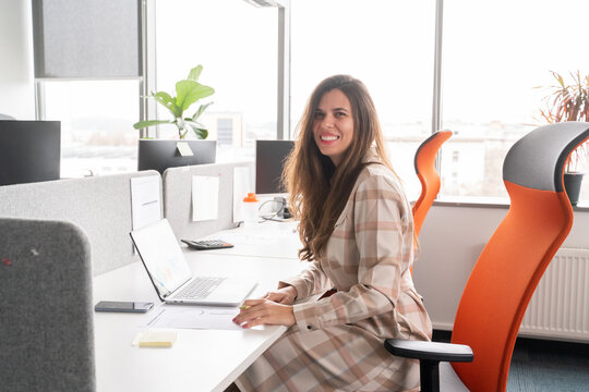 Woman Portrait At Her Desk In Office