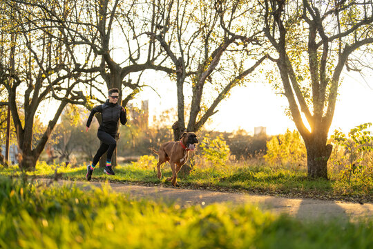 Outdoor run of woman and her dog