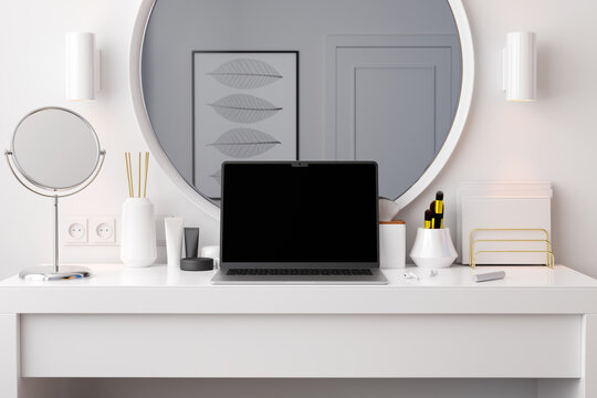 Laptop on dressing table with wireless earbuds earphones. 3D render.