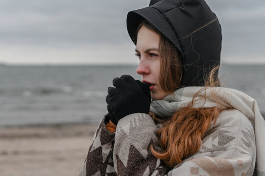 Winter portrait of woman in windy cold weather