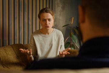 Serious woman talking with crop psychologist