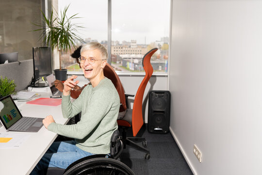Happy Woman At Office Desk