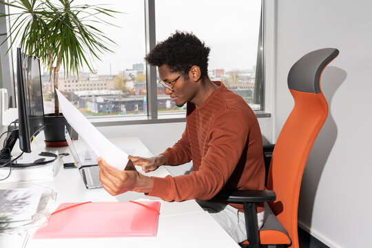 Man Working With Documents In Office