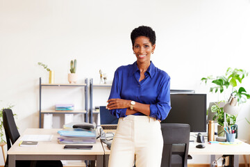 Positive black female manager in light office