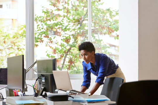Black manager checking connection of computers