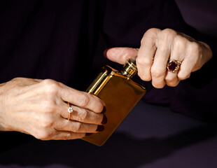 Woman Opening Hip Flask 