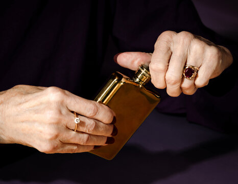 Woman Opening Hip Flask 