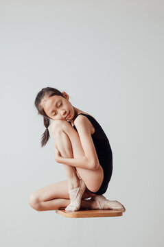 Portrait of little ballerina in leotard