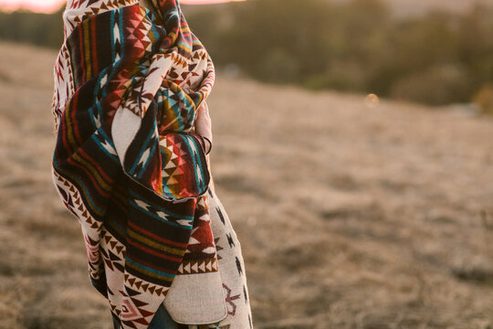 Cropped woman involved on a blanket outdoors