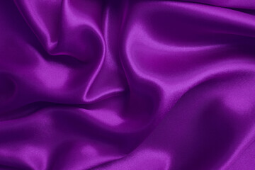 Dark purple fabric texture background, detail of silk or linen pattern.
