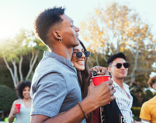 Drinks, party and a couple of friends outdoor to celebrate at festival, concert or summer social...
