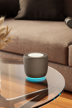 Non-brand smart speaker on living room table. Smart home concept.
