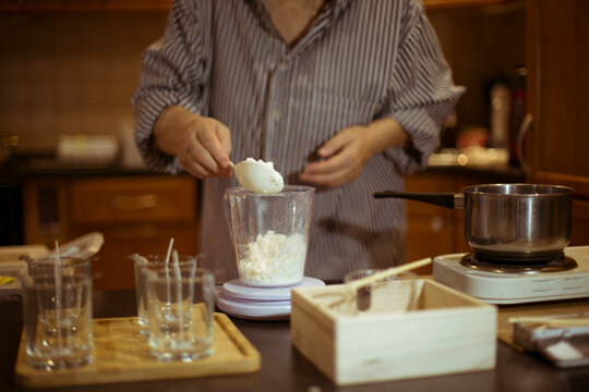 the process of creating candles at home.
