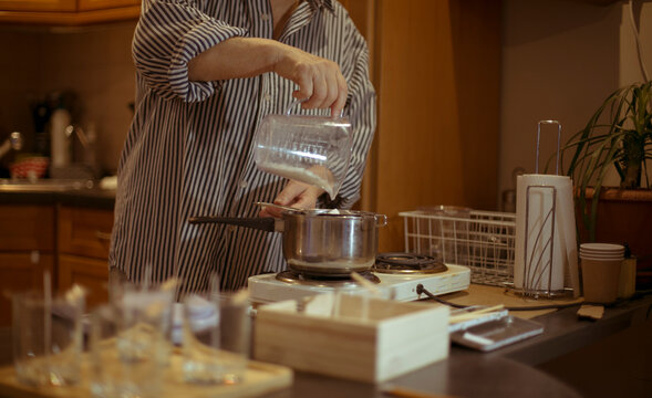 the process of creating candles at home.
