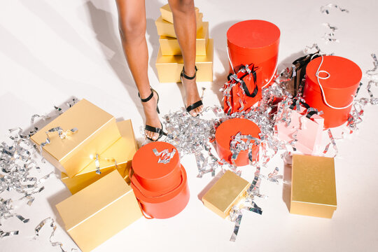 Many boxes with gifts and legs 