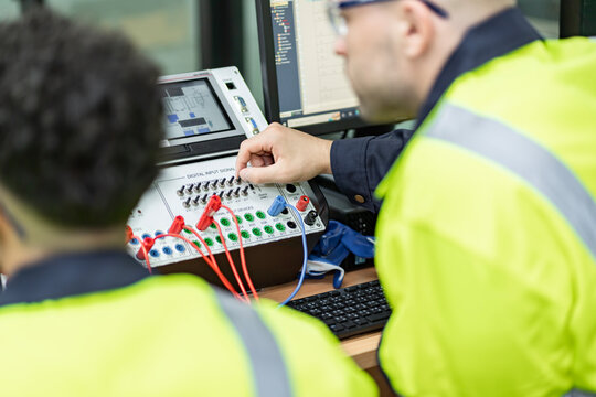 Electrical engineers supervise and design PLC electrical systems for companies or industrial factories.