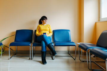 Woman in a waiting room inside the hospital