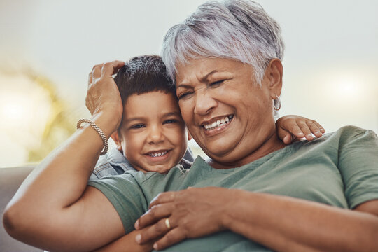 Happy, Grandmother And Grandchild On A Sofa, Smile And Laugh, Love And Family While Bonding In Their Home. Relax, Grandma And Child Embrace, Funny And Joke On A Couch, Loving And Sweet In Living Room