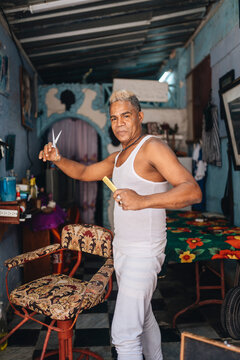 Professional Cuban barber with scissors
