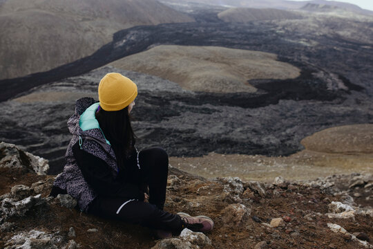 Scenery View Of young Women looking on volcano in Iceland
