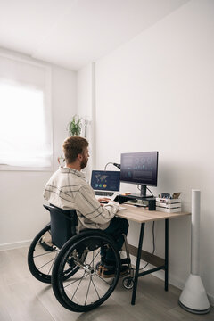 Handicap Man Working in Home Office