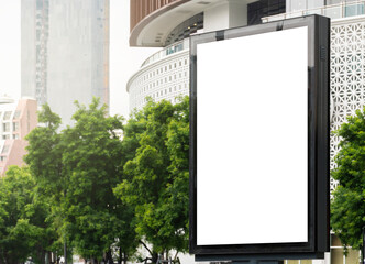 Outdoor pole billboard with mock up white screen on city view background and clipping path