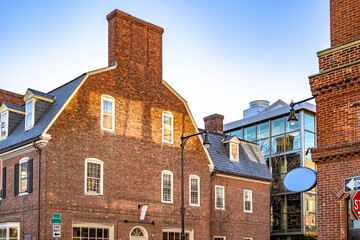 Combination of old red brick residential architecture with attic apartments and modern urban development in Cambridge New England