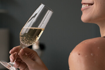 Pretty woman drinking sparkling wine