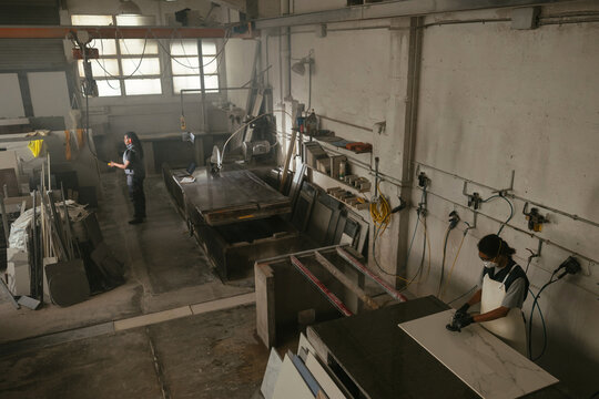 Women working in spacious marble workshop