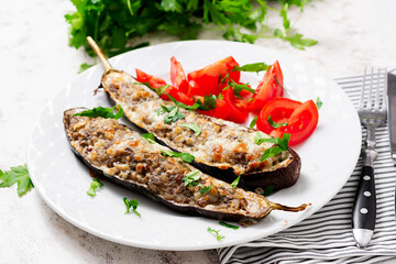 Stuffed eggplant with beef meat, vegetable and cheese.