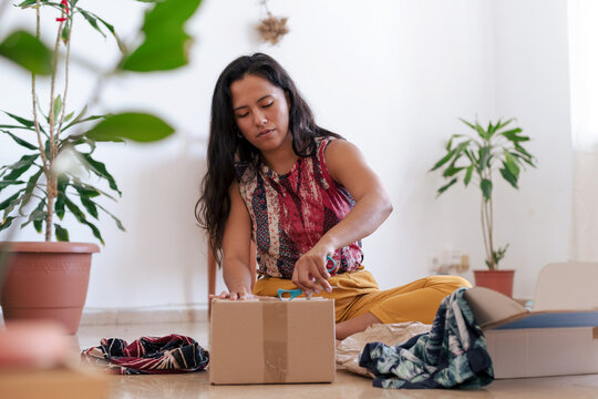 Woman opening a package