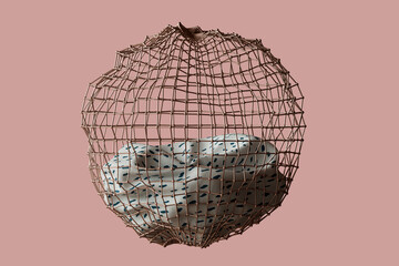 a golden cage with a bedsheet in it