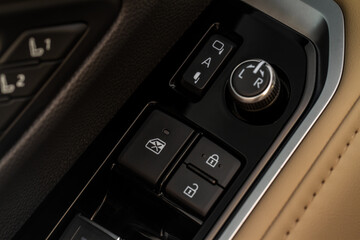 Obraz premium Car central door lock and unlock button close up. Close and open signs.