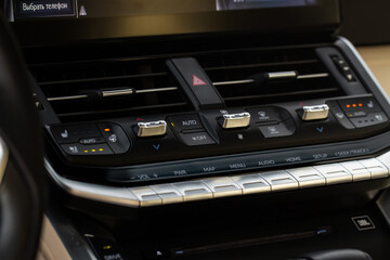 Car air conditioner dashboard. Modern car interior. Adjustable air conditioner. Car air conditioning system.