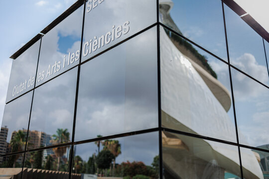 Valencia, Spain - july 2022: Script City of Arts and Sciences on Windows of a Building with Mirrored Glass in Valencia, Spain