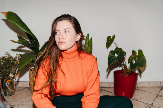 Woman in orange sweater
