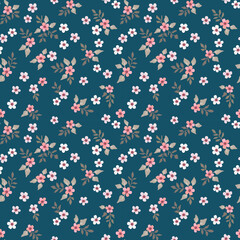Vector floral seamless pattern with small flowers on a dark background. Vintage rustic style. For fabrics, textiles and design.