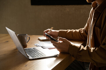 Man paying utility bills  from home 