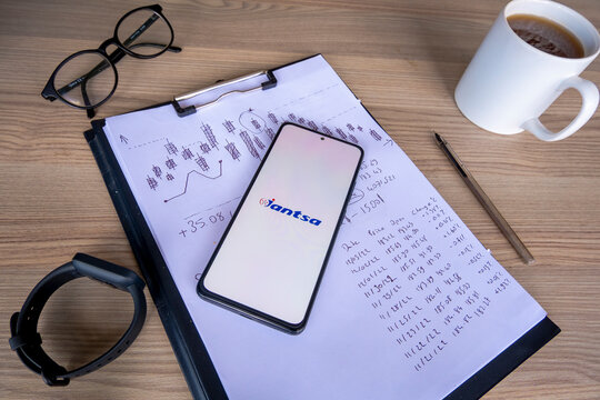 Analyzing Bist 100 Jantsa Jant Sanayı stock share, focus on Turkish stock market, logo on mobile phone