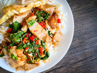 Rice topped with crispy pork belly with Thai basil and fried egg