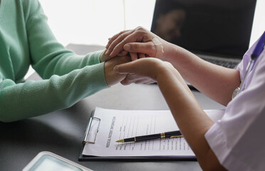  consulting female patient about pills and discussing health treatment sitting in the office at the desk. Medicine and health care concept. Doctor prescribing medicine to patient in the office.