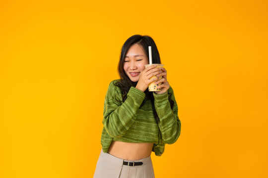 Smiling Asian woman with boba tea