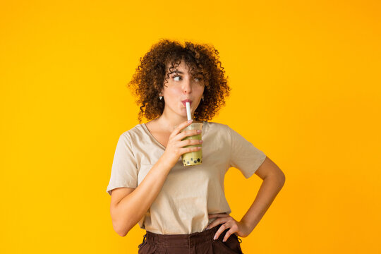 Cheerful woman with tasty bubble tea