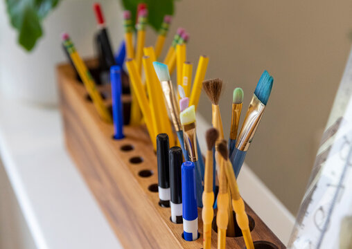 Close up Pencils and pens in design studio in home office organizer