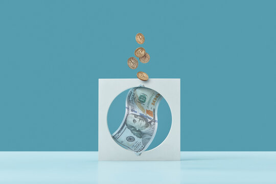 Dollar and cents inside white concrete display.