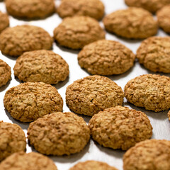 Homemade oatmeal cookies. Fresh pastries in bakery. Healthy sweets made from whole grain flour.Dessert on wooden table. Close-up. Soft focus. Top view. High quality photo