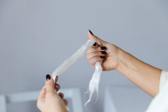 Hands holding silk yarn